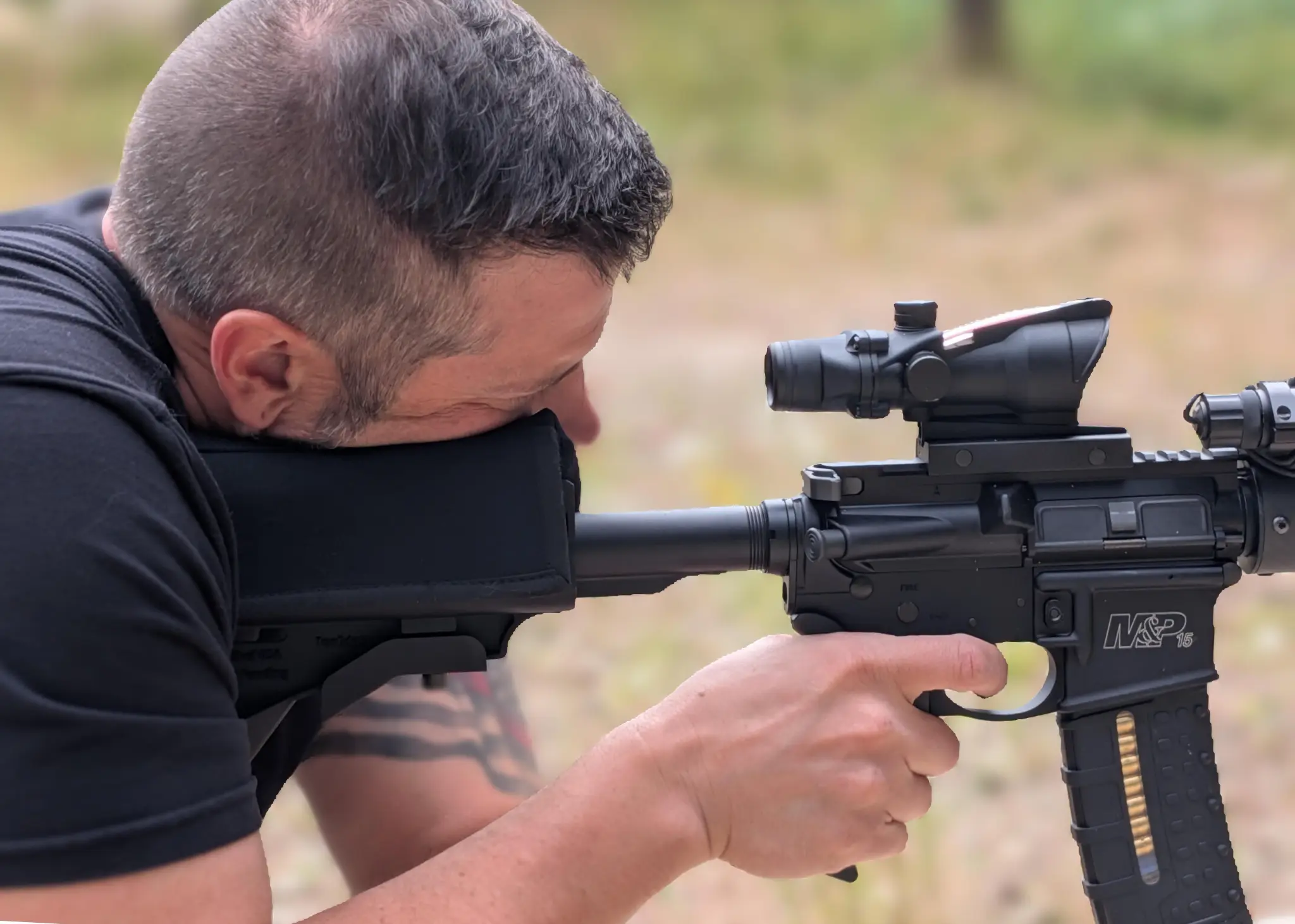 Professional shooter using TacEdge stock for precision shooting